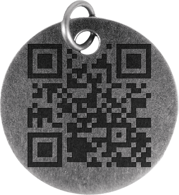 The back of a Novations pet tag, with a scannable QR code engraved into the metal