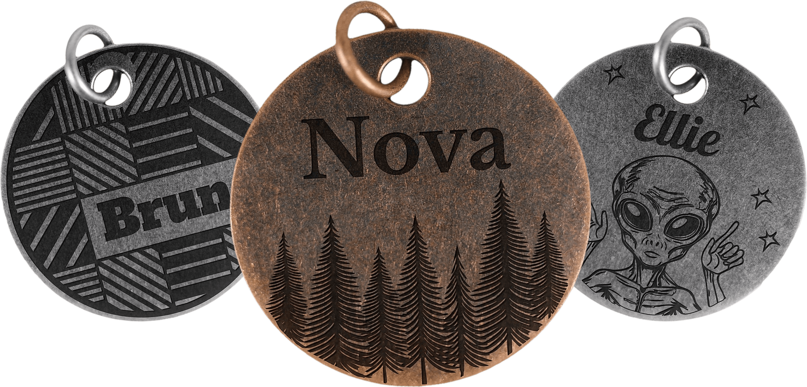 Three engraved pet tags: a mountain range, Saturn, and a howling wolf